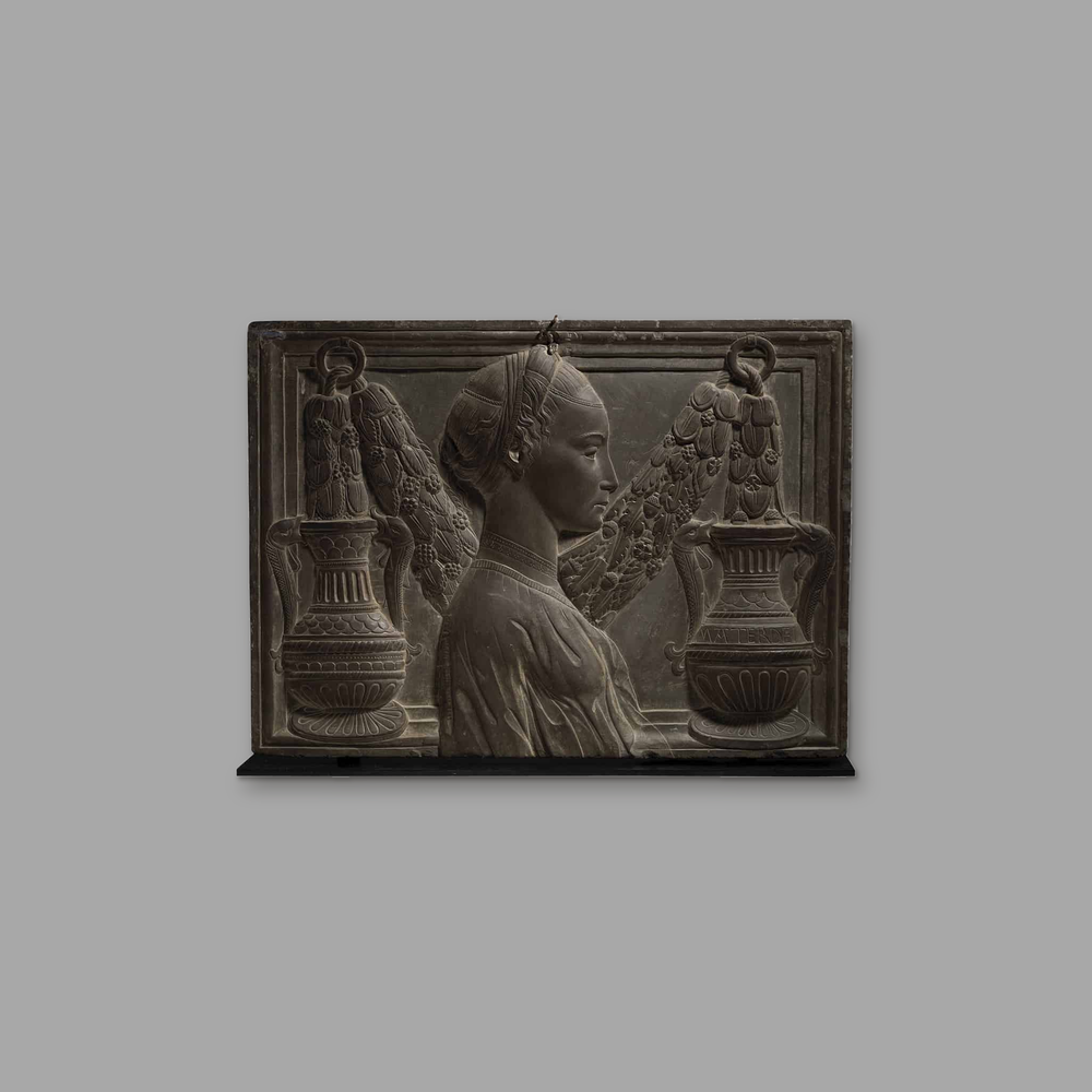 Renaissance Revival Pietra Serena Carved High Relief Plaque, on a plain mid-grey background.
