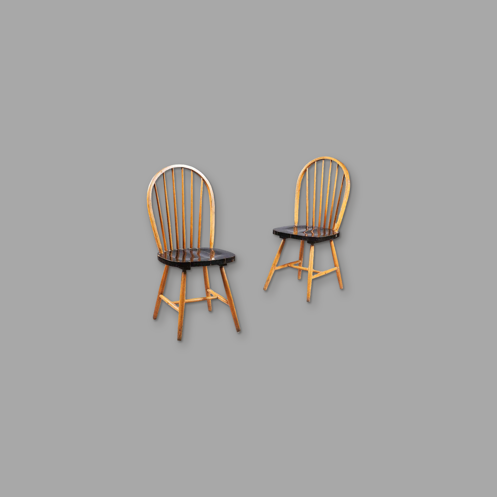 Pair Of Indian Hoop Back Chairs, on a plain mid-grey background.