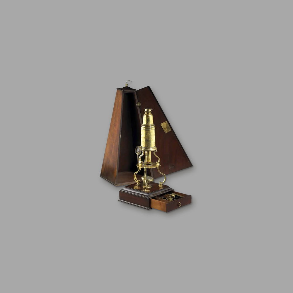 Culpeper microscope, on a plain mid-grey background.