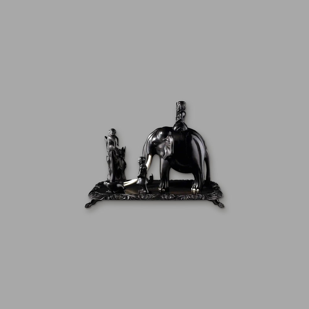 Indian Ebony Carved Group, on a plain mid-grey background.