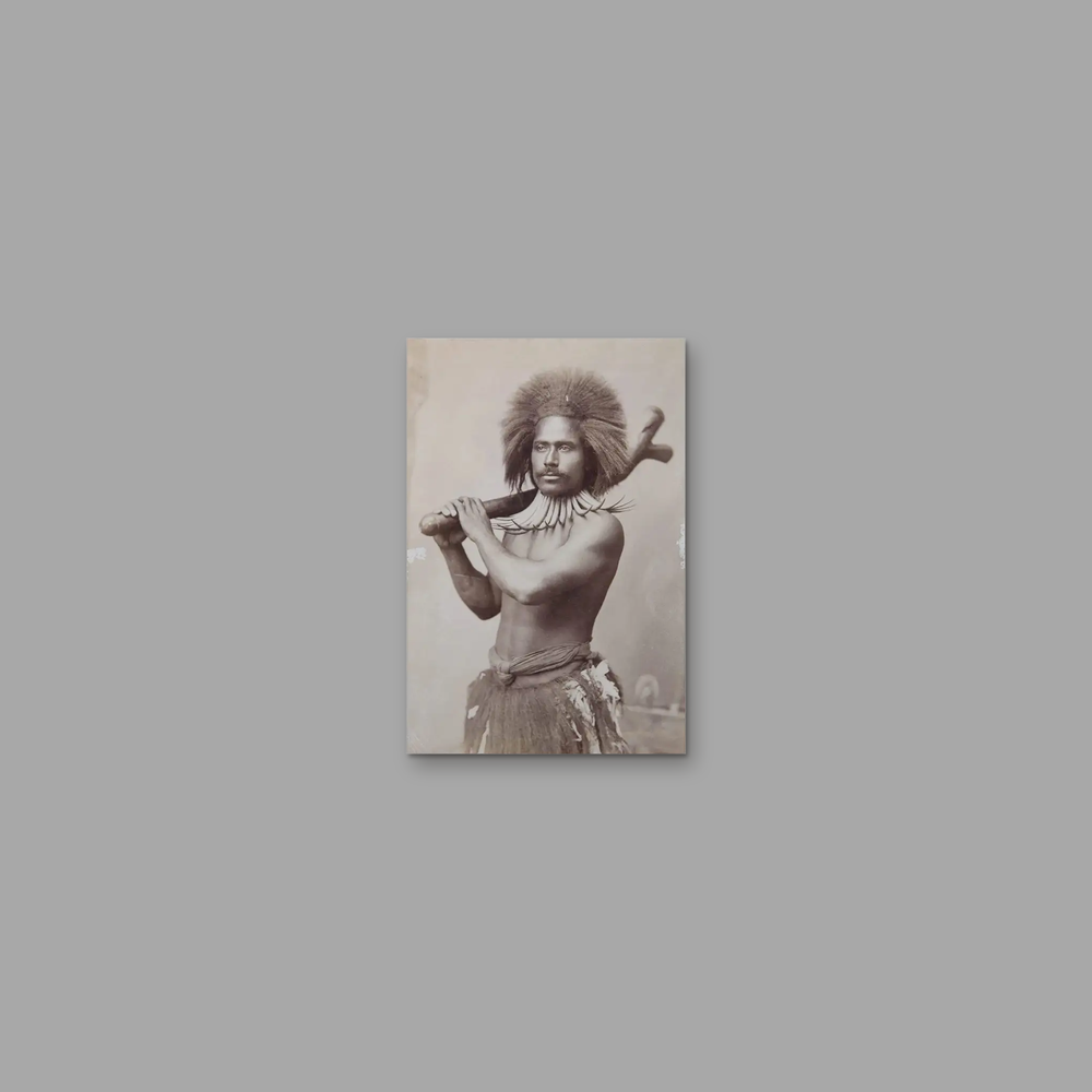 Ratu Udre Udre – With a War Club, on a plain mid-grey background.