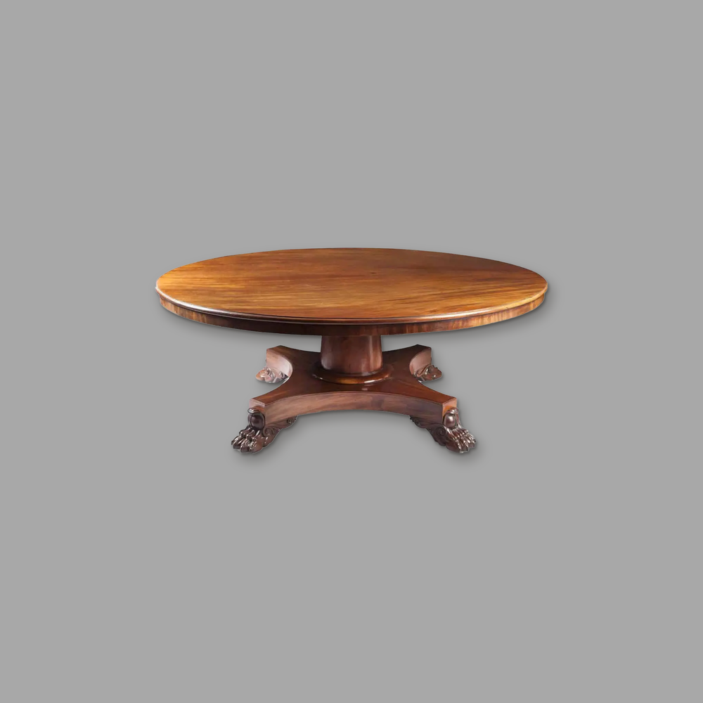 Exceptional Mahogany Round Dining Table, on a plain mid-grey background.