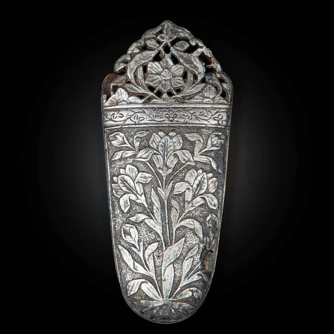 Intricately carved 17th century Mughal cut-steel sword chape with floral design by Nwtiques