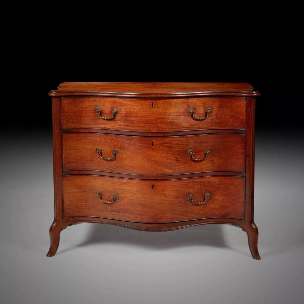 George III serpentine chest of drawers in mahogany with gilt brass handles by Henry Hill Collection CK20