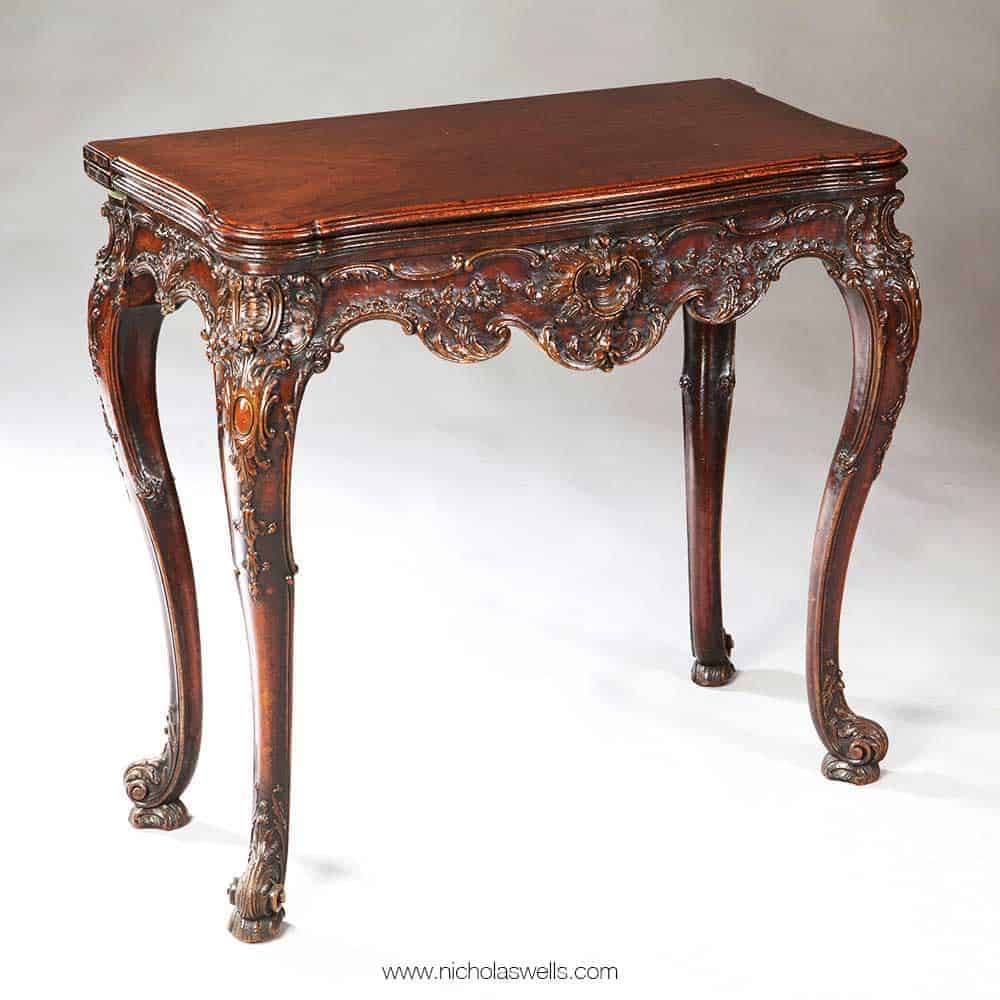 Rococo Chippendale mahogany card table with ornate carving and cabriole legs by The Sold Archive, 19th century England