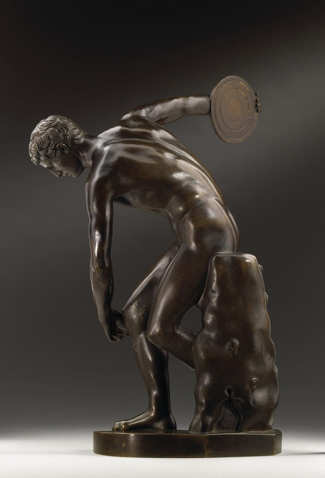 Discobolus After Myron bronze sculpture depicting a discus thrower, 19th century antique inspired by Greek art.