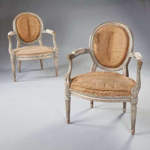 Pair of transitional Louis XV style fauteuil armchairs by Nwtiques with oval backs and fluted legs