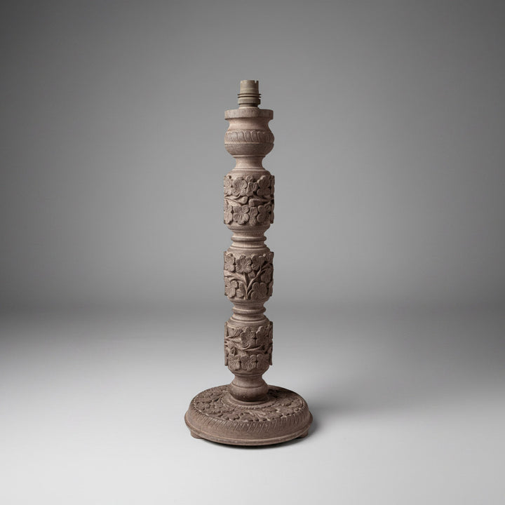 A group of four Indian carved wooden lamp bases