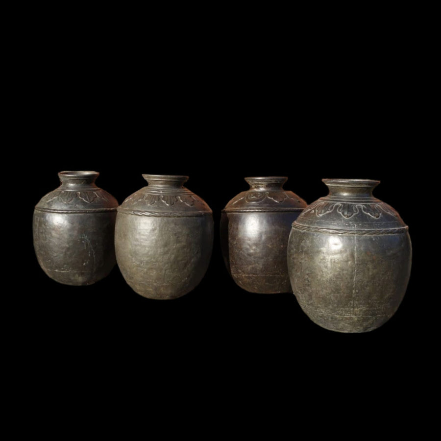 Set of four large scale Sindh bronze pots from Collection EE10, circa 1900, with detailed patterns on a black background