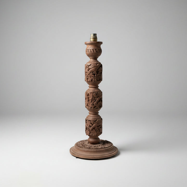 A group of four Indian carved wooden lamp bases