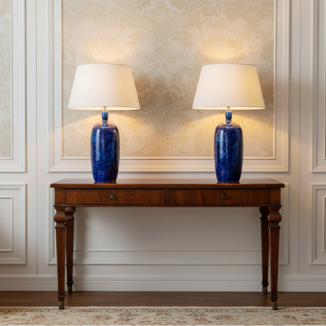 Pair of hand-crafted cobalt blue crystalline glazed ceramic table lamps on wooden table by Nwtiques