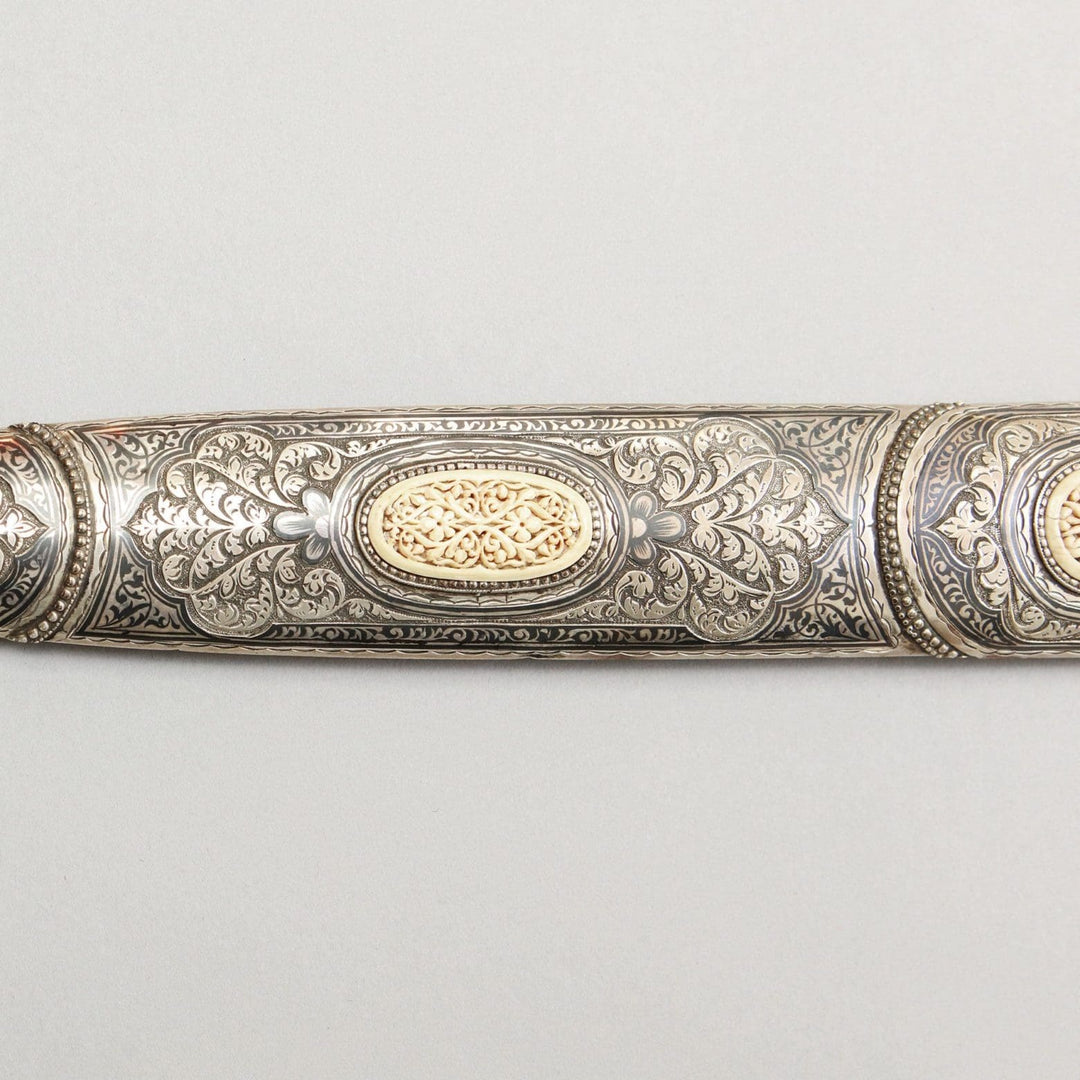 Close-up of an intricately decorated silver and ivory kindjal scabbard by Nwtiques