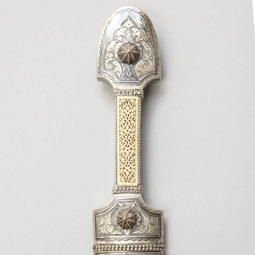 Detailed handle of Caucasian Kindjal with intricate metalwork and ivory inlay from Nwtiques