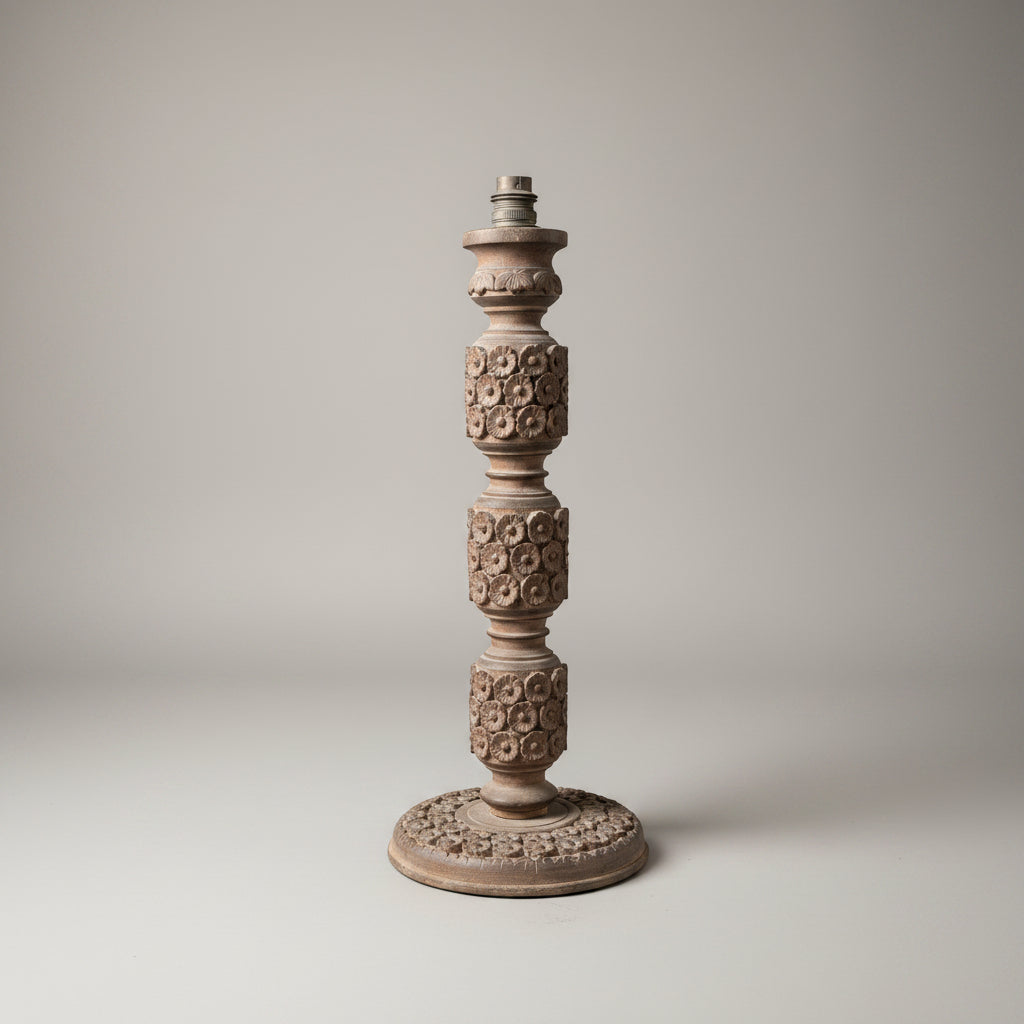 Decorative candlestick with intricate patterns on a plain background
