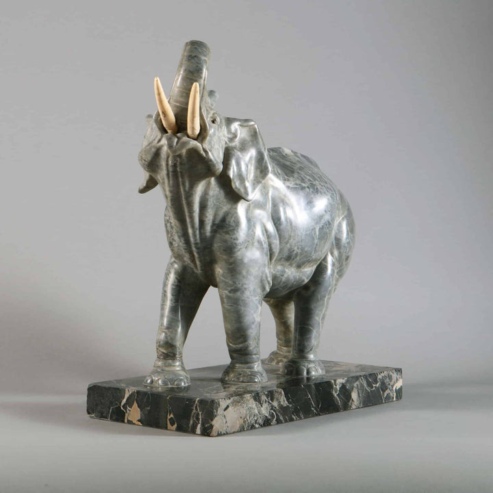 Grey Marble sculpture of an Elephant with raised trunk on a Portoro marble base, circa 1880, French craftsmanship.