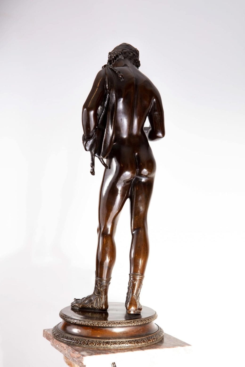 Dionysus – “Narcissus” 19th Century Bronze Statue showing detailed rear view of classical figure with dark patina.