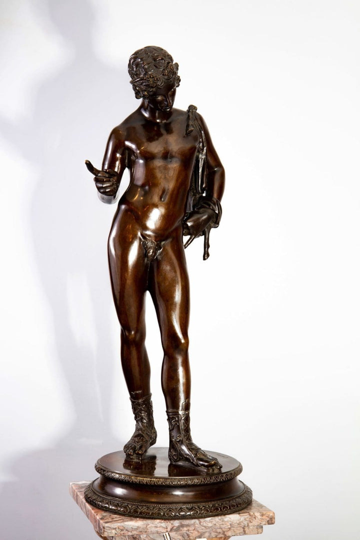 Dionysus – “Narcissus” 19th Century Bronze Statue of a nude male figure with black-brown patina on a decorative base.