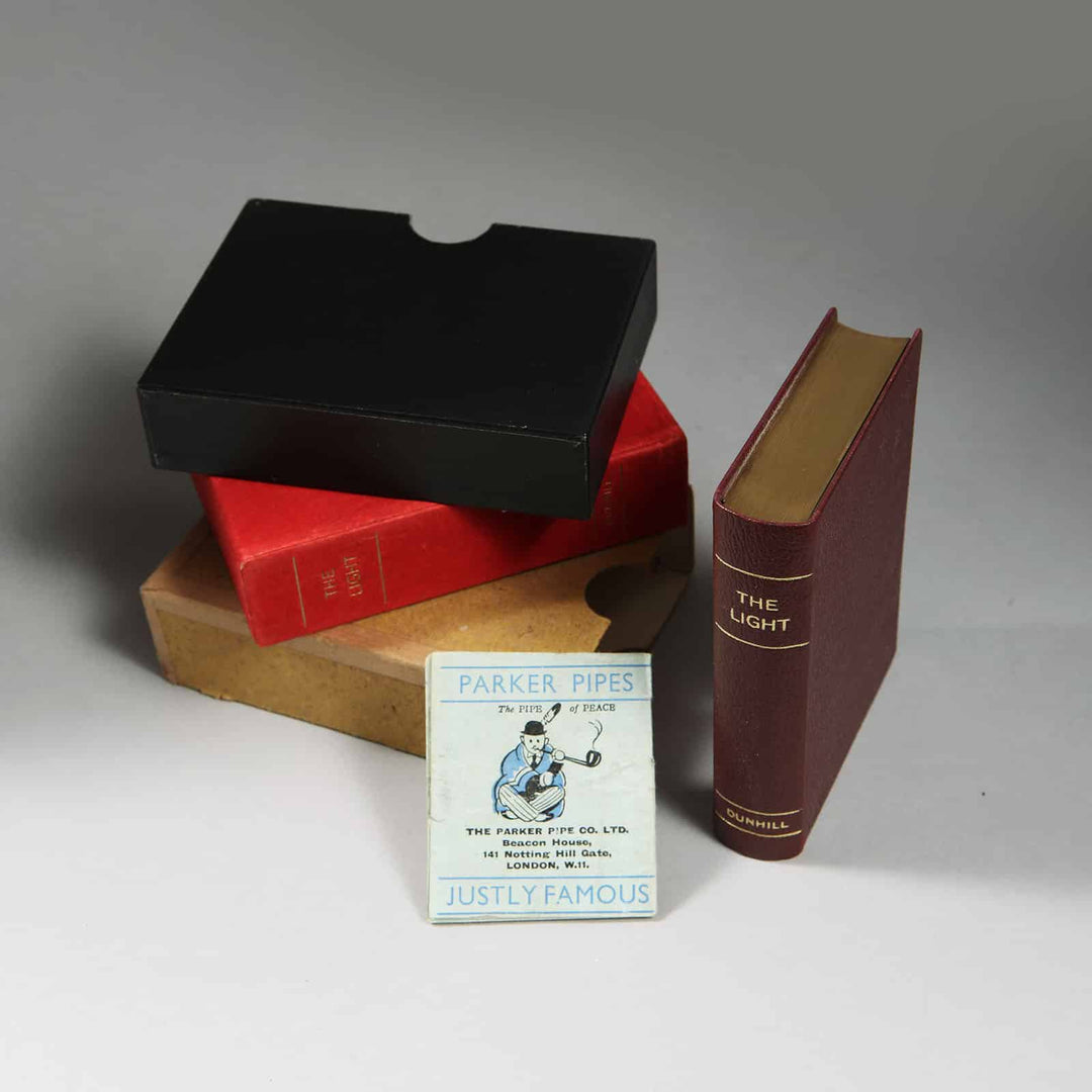 Dunhill The Light novelty petrol lighter shaped like a leather-bound bible with gilt edges from Nicholas Wells Antiques