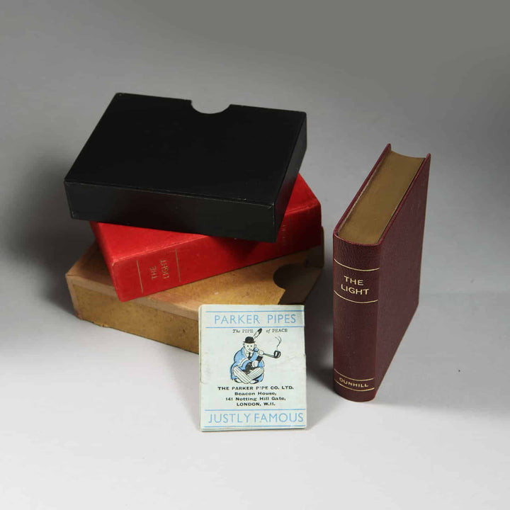 Dunhill The Light novelty petrol lighter shaped like a leather-bound bible with gilt edges from Nicholas Wells Antiques
