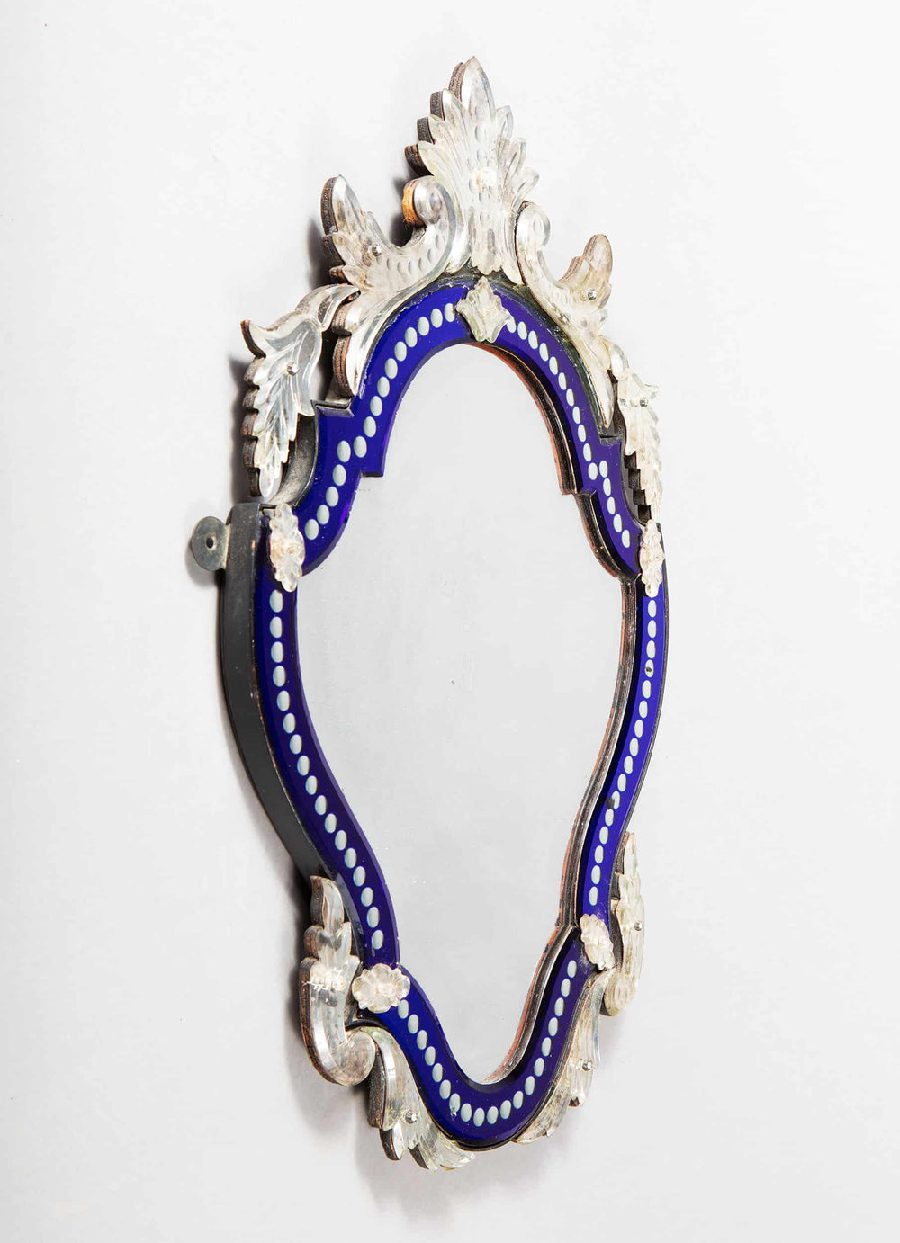 Early 20th Century Venetian blue border glass mirror with shaped bevelled plate and foliate details.