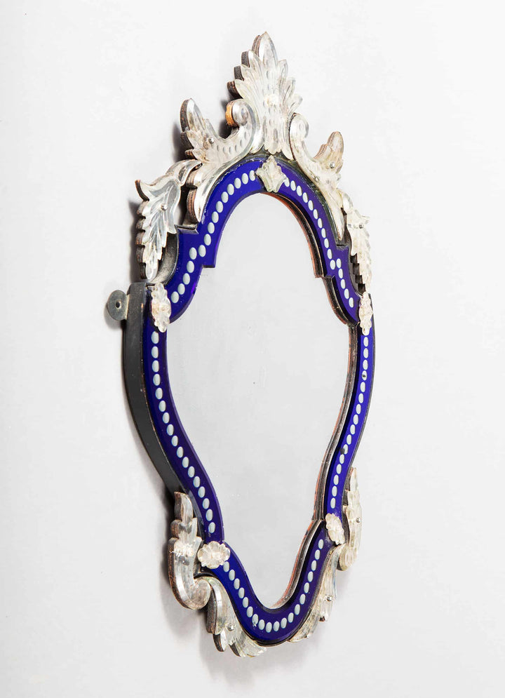 Early 20th Century Venetian blue border glass mirror with shaped bevelled plate and foliate details.