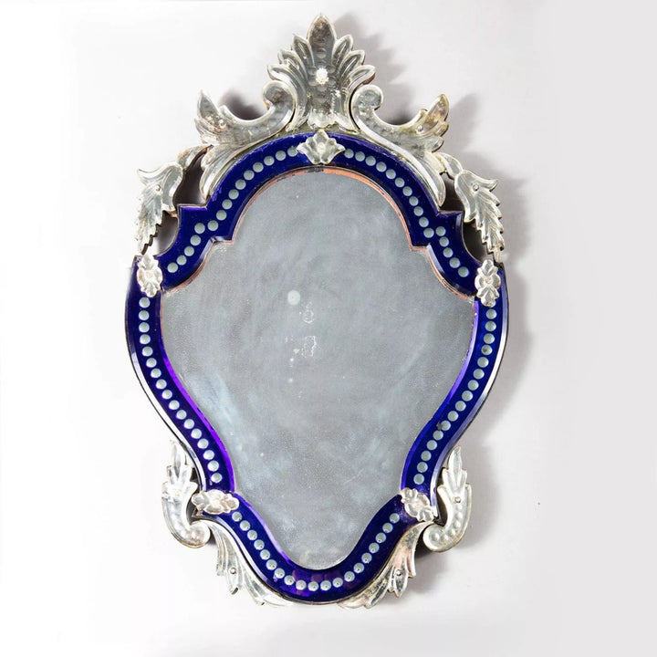 Early 20th Century Venetian blue border glass mirror with shaped bevelled plate and foliate cut details.
