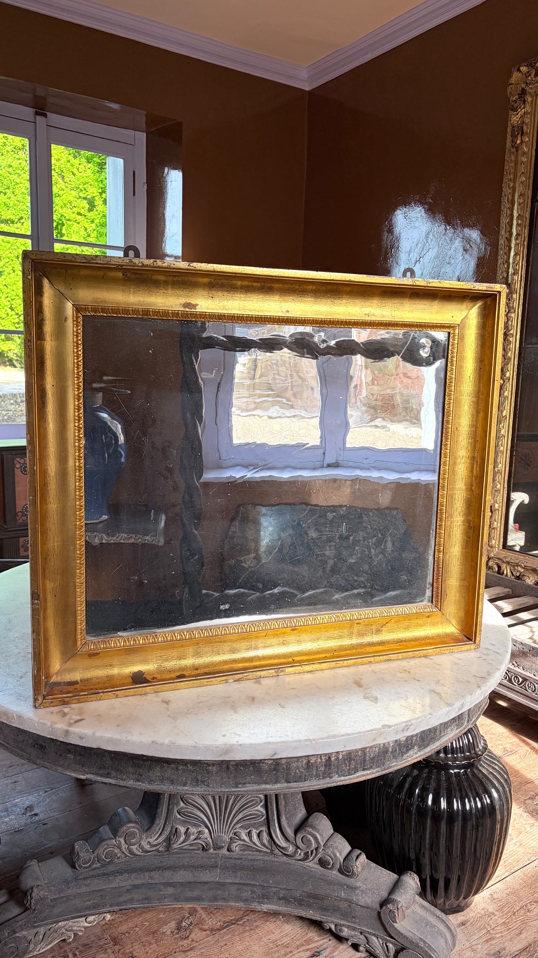 An Italian Water-Gilt Mirror with Original Hand-Blown Glass