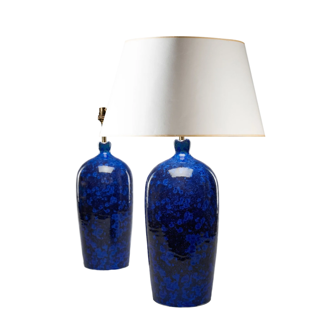 A fine pair of deep blue crystalline ceramic lamps with scalloped rims by Nwtiques