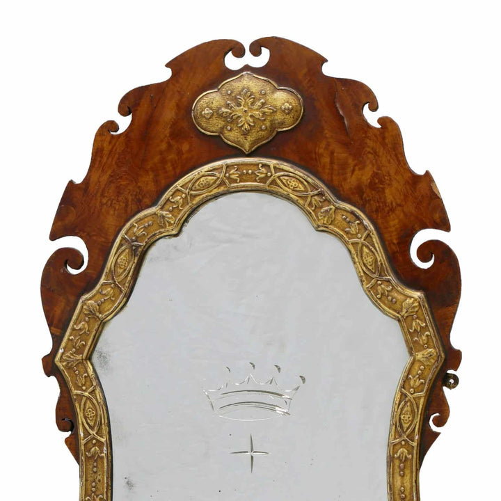 A George III flame veneered mahogany wall mirror with gilt gesso strapwork frame and engraved coronet circa 1770.