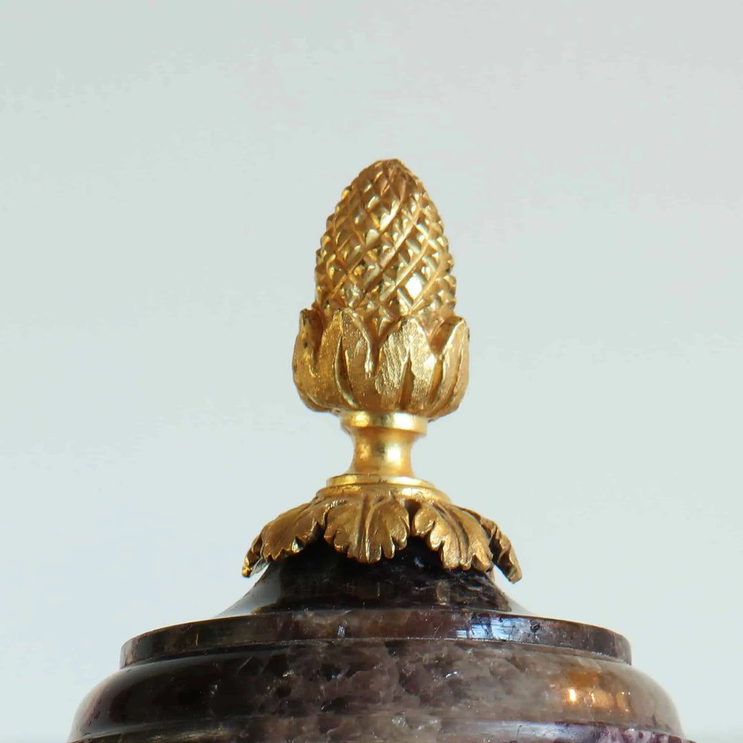 Close-up of gilt bronze pine cone finial atop a Blue John urn by Collection CK20, Georgian era craftsmanship.
