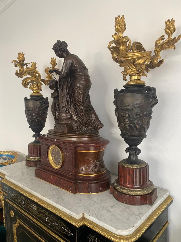 19th century Napoleon III bronze clock set with rouge marble and ornate candelabra by Nwtiques