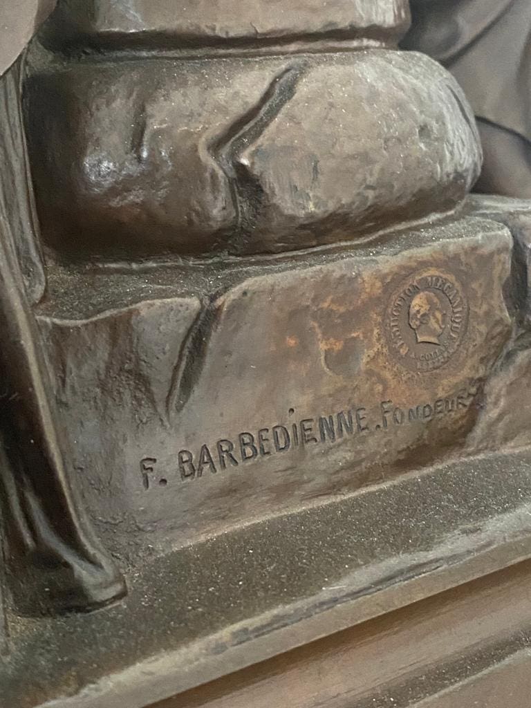 Close-up of F. Barbedienne Foundry mark on Napoleon III Rouge Marble and Bronze Clock Set by Nwtiques