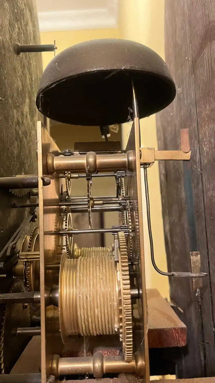 Close-up of intricate brass clock mechanism and bell from an 18th-century Sanders of Manchester by Collection PK10