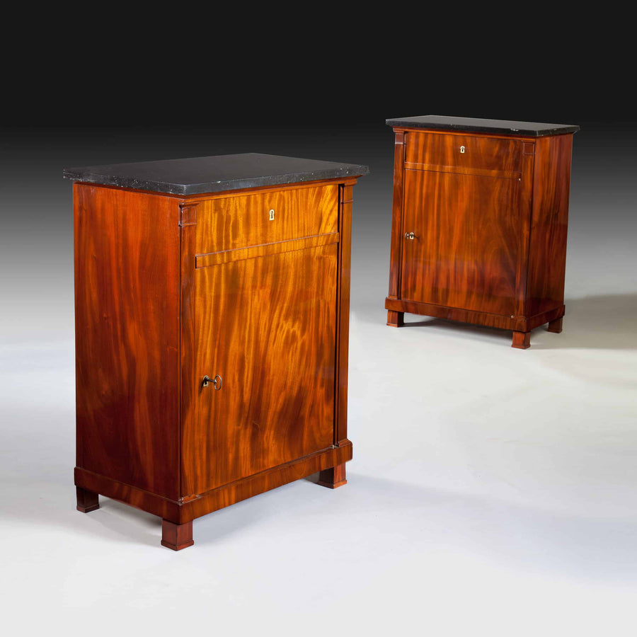 Pair of French Empire mahogany side cabinets with black marble tops by The Sold Archive