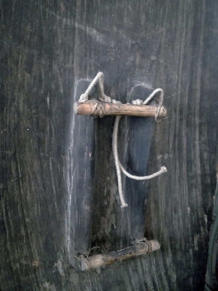 19th-century Bahinemo war shield from Papua New Guinea displayed by Collection ON10 with wooden handles and rope attachments