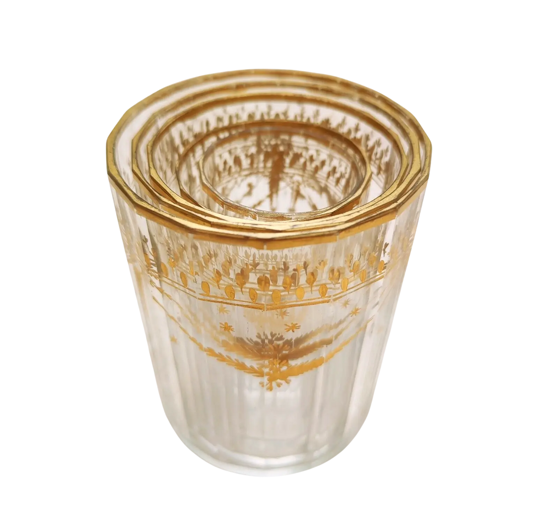 Set of five Bohemian gilt beakers with floral garlands by Nwtiques, circa 1780, clear faceted glass