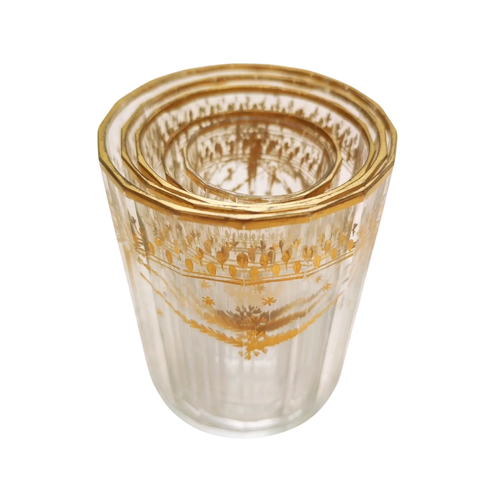 Set of five Bohemian gilt beakers with floral garlands by Nwtiques, circa 1780, clear faceted glass