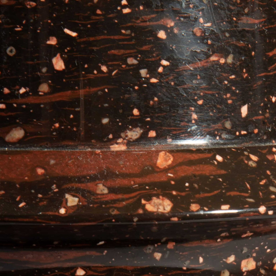 A rare large scale Swedish porphyry vase as a lamp with black and reddish stone patterns close-up.
