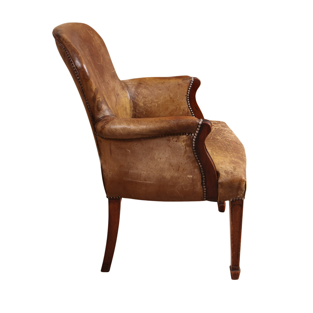 19th century late Georgian style leather desk chair with worn patina and scroll arms from Collection TH30