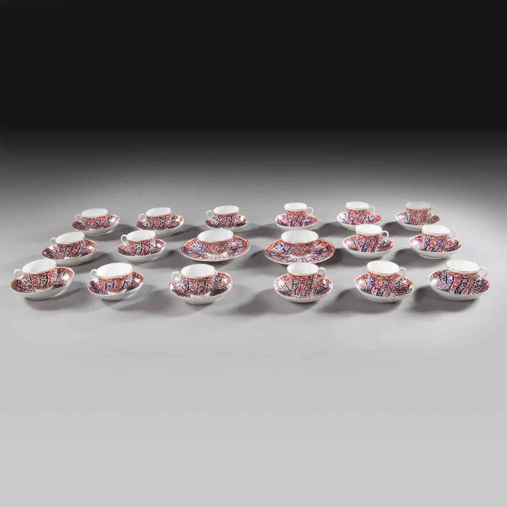 Worcester Queen Charlotte pattern teacups and saucers set of 20 pieces by Collection TH10 displayed on gray surface