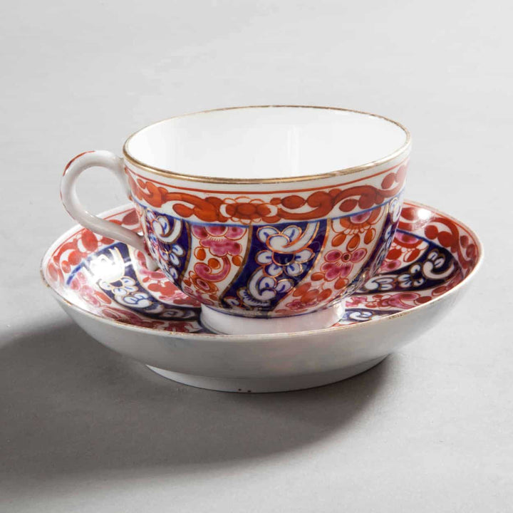 Regency porcelain teacup and saucer with ornate Worcester Queen Charlotte pattern by Collection TH10