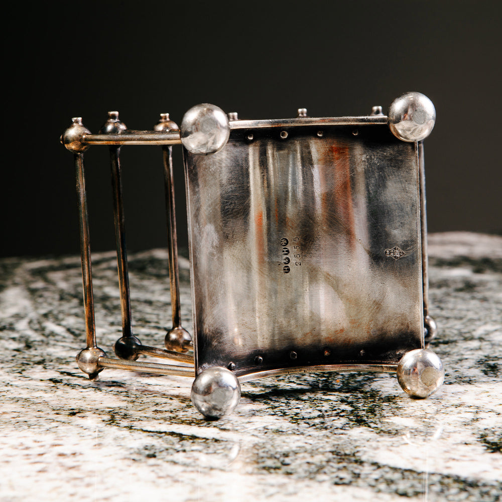 Silver-plated letter rack in the manner of Dr Christopher Dresser by Collection TH30 on marble surface