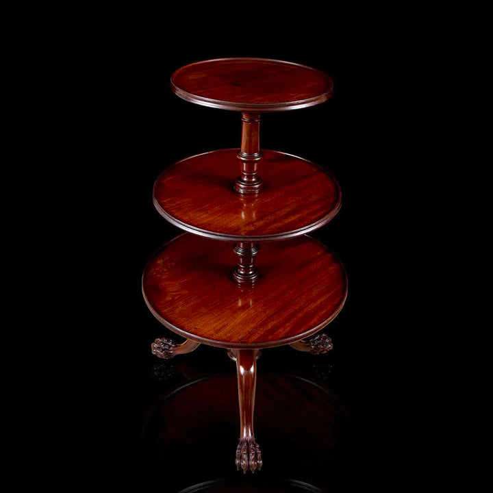 George II Mahogany Revolving Dumbwaiter with three tiers and hairy paw feet, mid-18th century Chippendale style.