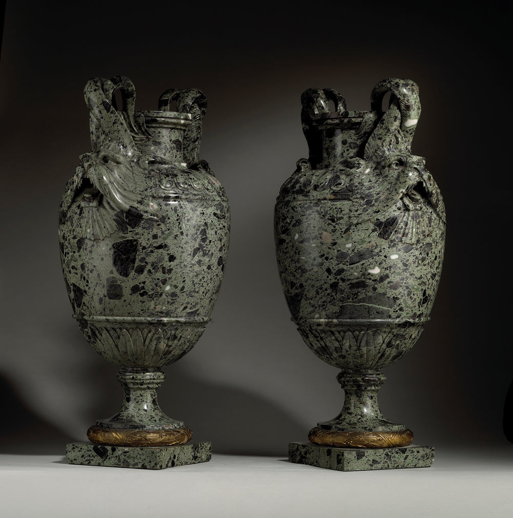 Pair of green marble vases with marine animal handles on pedestal base by Nicholas Wells Antiques
