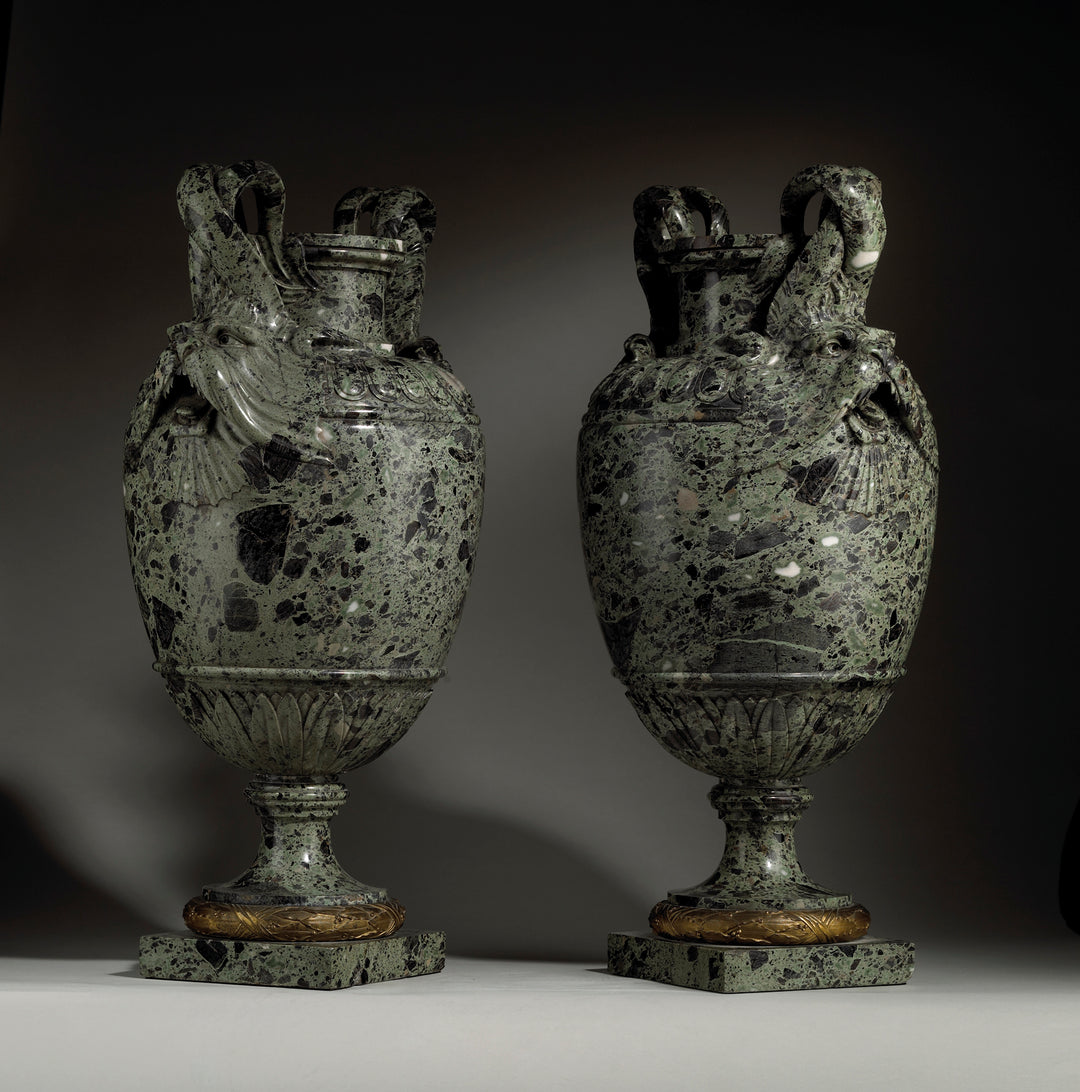 Pair of green marble vases with marine animal handles on pedestal base by Nicholas Wells Antiques