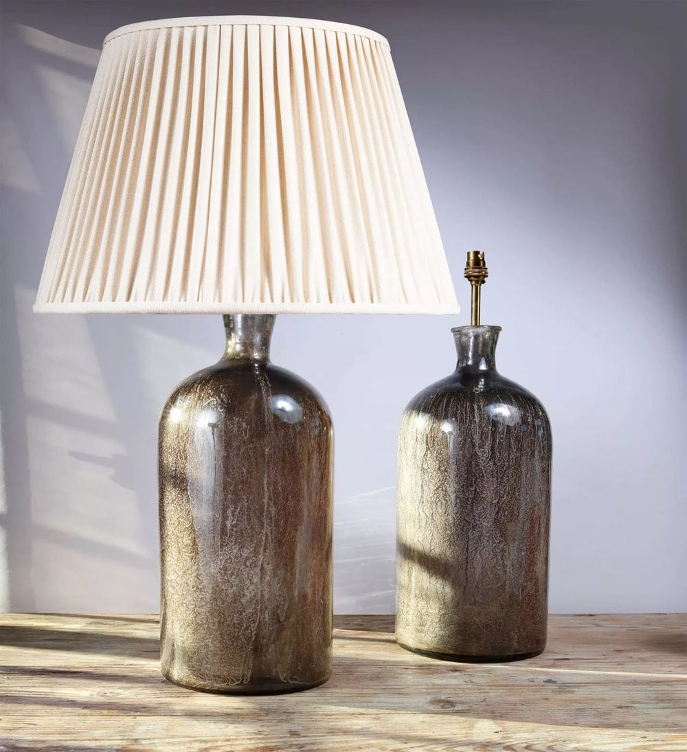 Large pair of decorative Eglomise Glass Jars at table lamps with antique silvered finish on wooden surface.