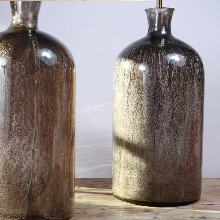 Large pair of decorative Eglomise Glass Jars with antique silvered eglomisé finish on a wooden table.