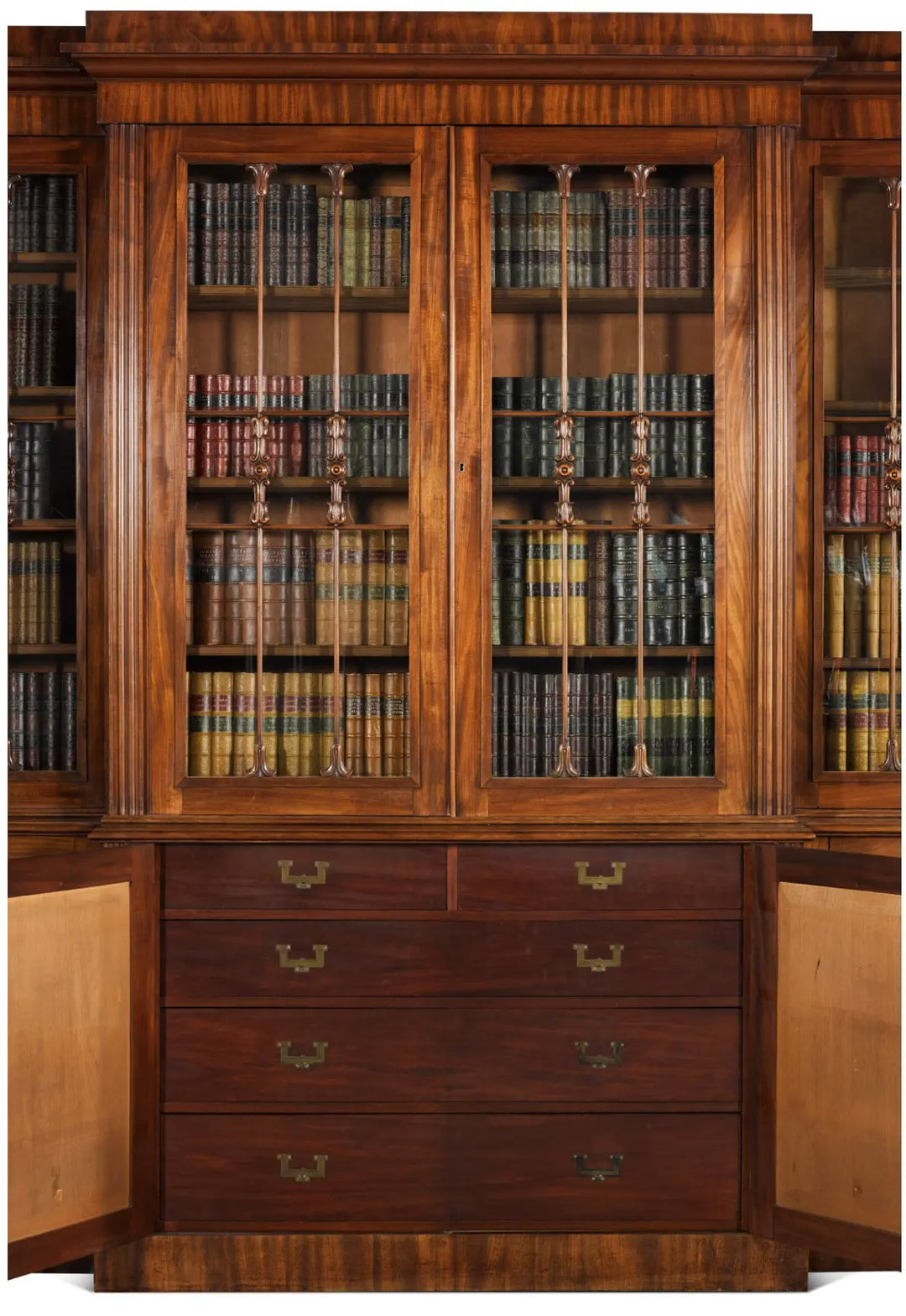 Regency mahogany breakfront bookcase by Nwtiques with glass doors and brass handles, circa 1815 England