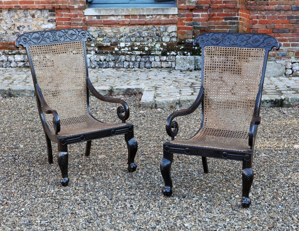 Pair of 19th century Anglo Indian solid ebony caned armchairs with carved vine details by ANTIQUES