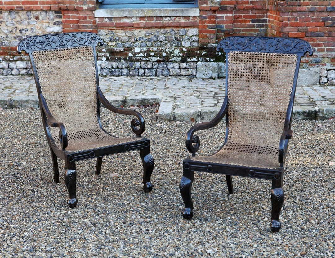 Pair of 19th century Anglo Indian solid ebony caned armchairs with carved vine details by ANTIQUES